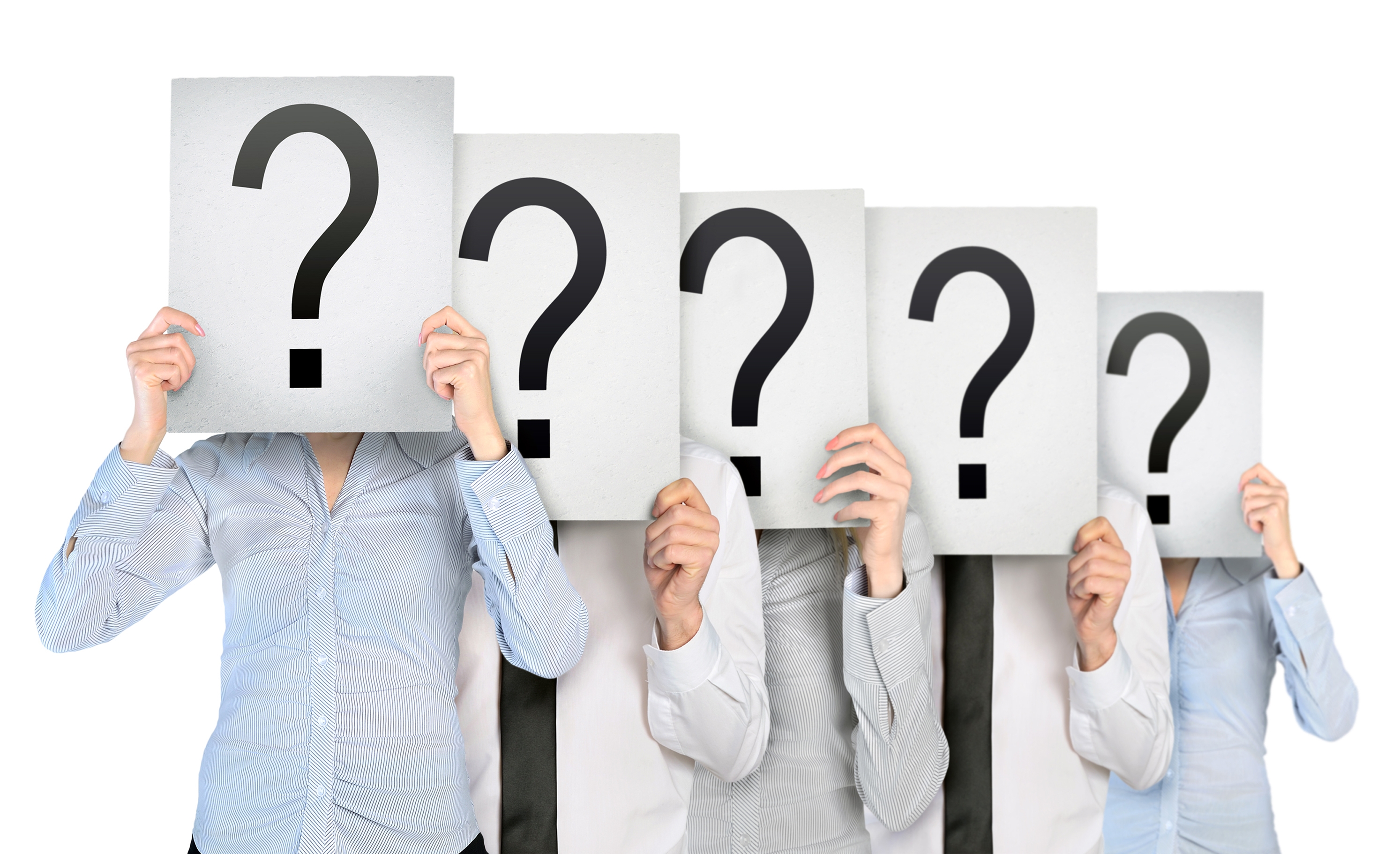 people holding up signs with a question mark on them