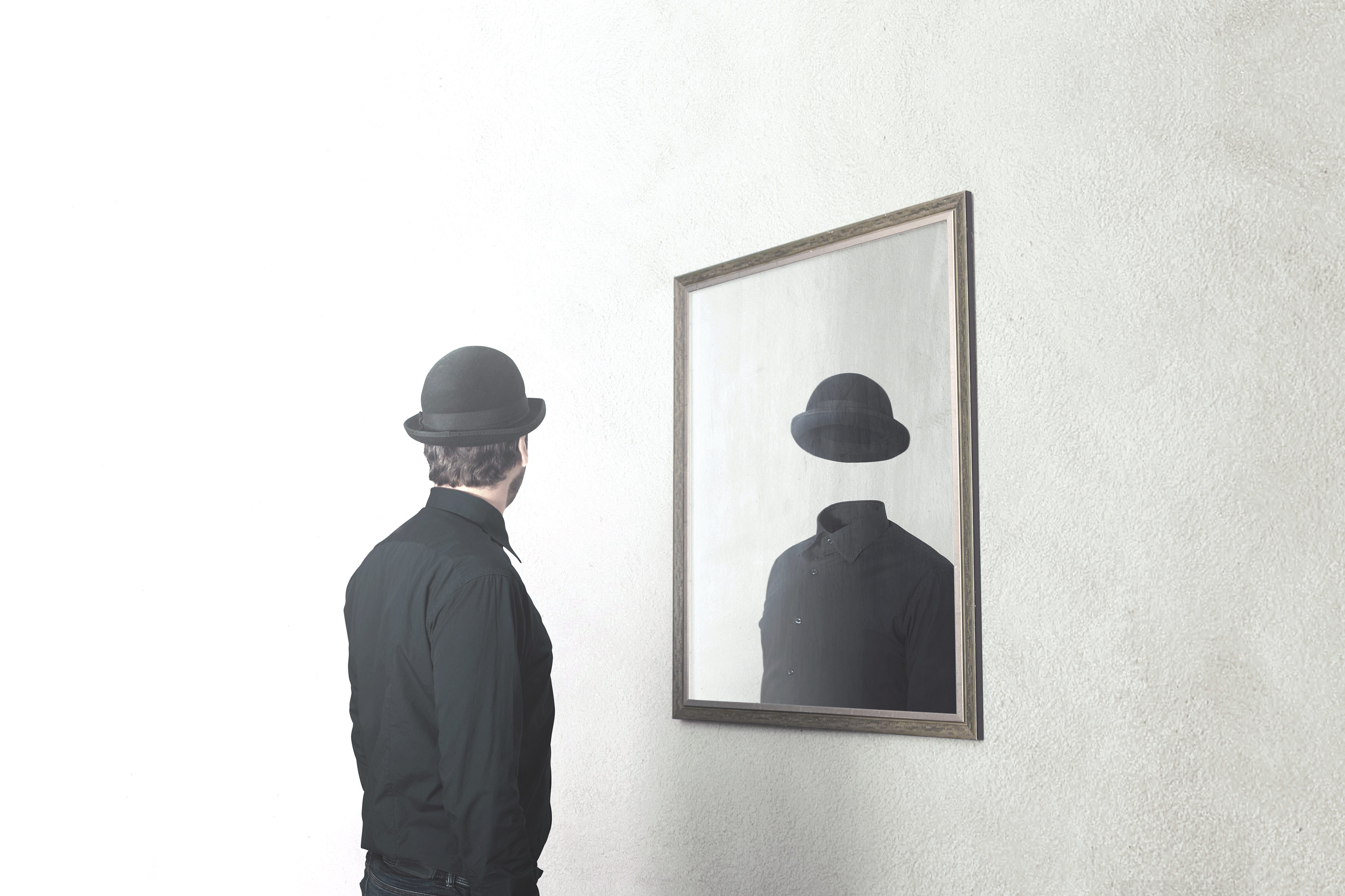 man looking in mirror