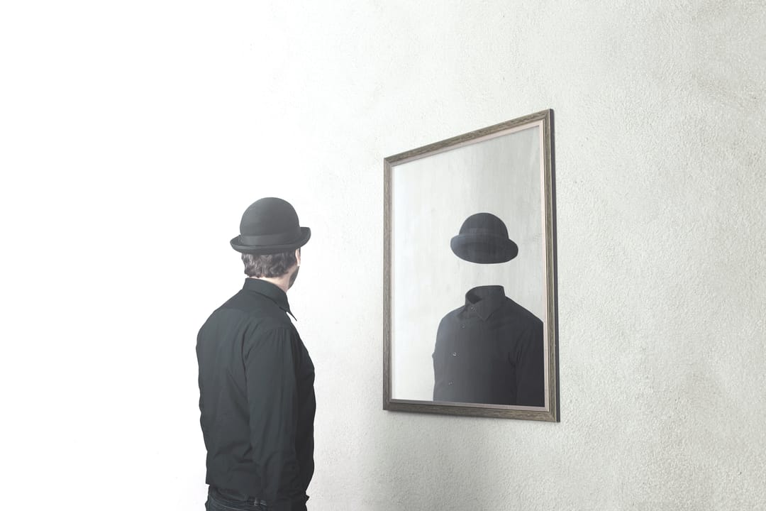 man looking in mirror