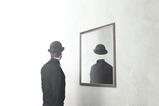 man looking in mirror man looking in mirror
