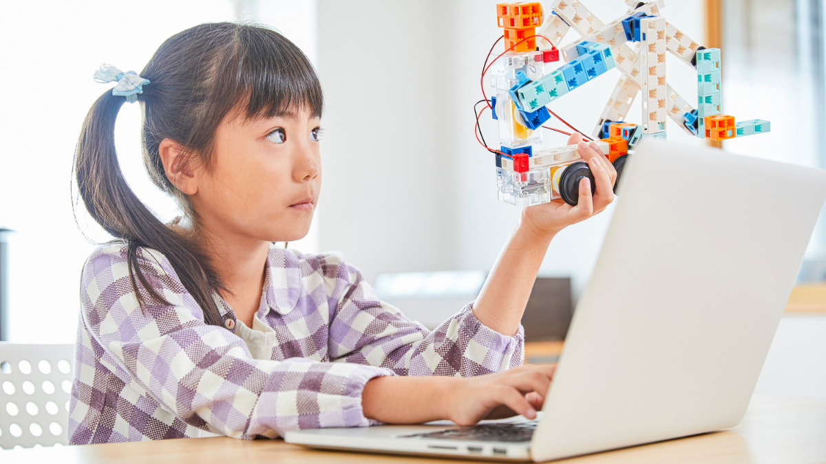 Young girl in front of laptop