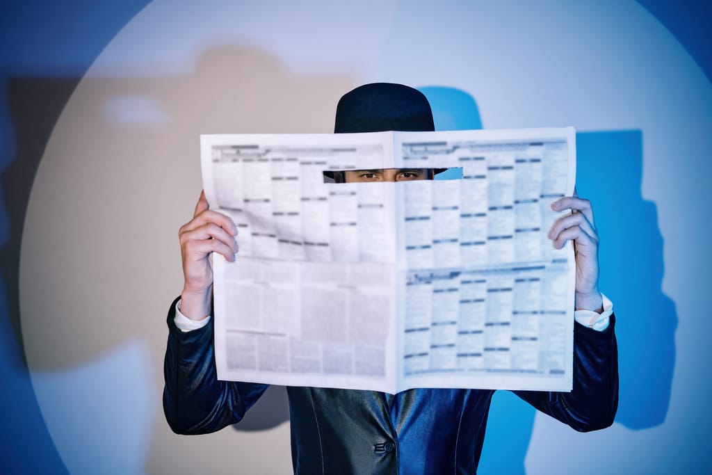 Man,Hiding,Watches,Through,The,Newspaper,In,The,Spotlight,On Man,Hiding,Watches,Through,The,Newspaper,In,The,Spotlight,On