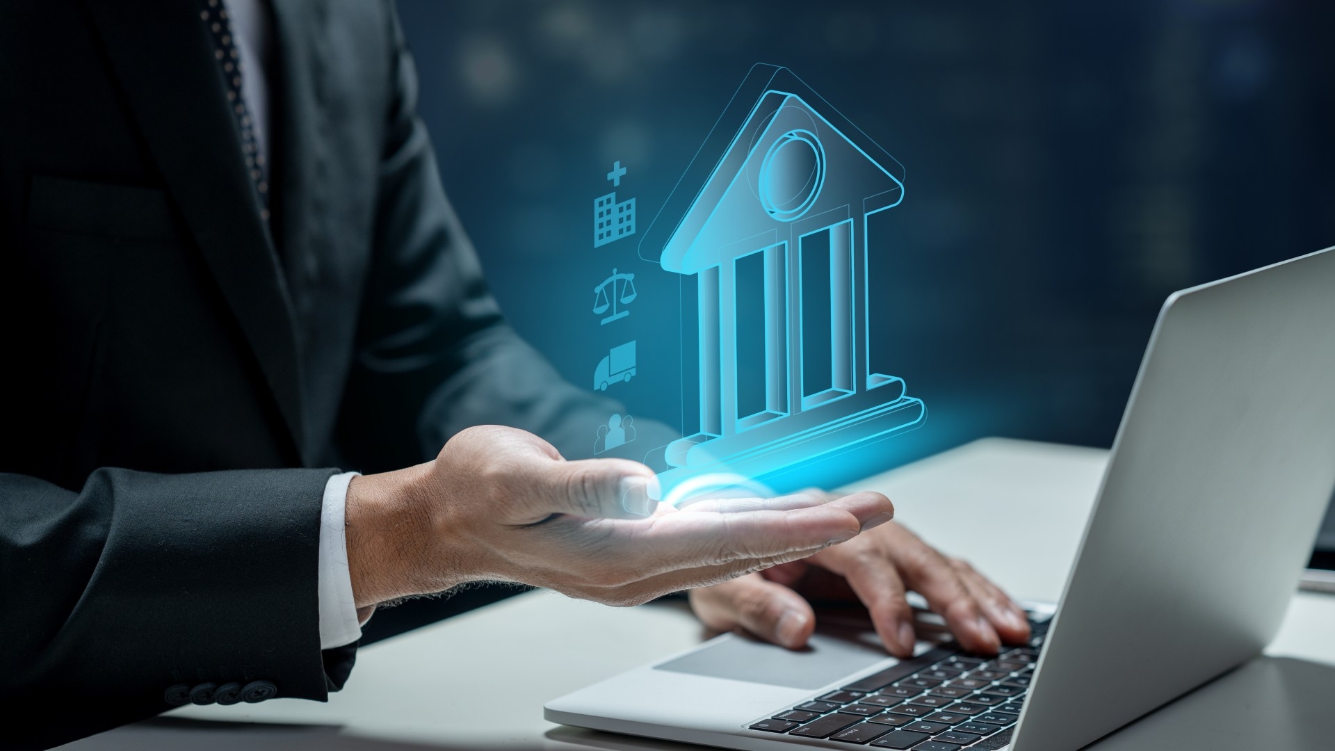 Businessman,Using,A,Laptop,While,Showing,A,Government,Icon.,Technology