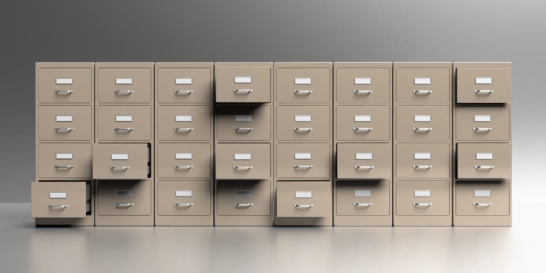 Office,Filing,Cabinets,With,Open,Drawer,In,A,Gray,Wall