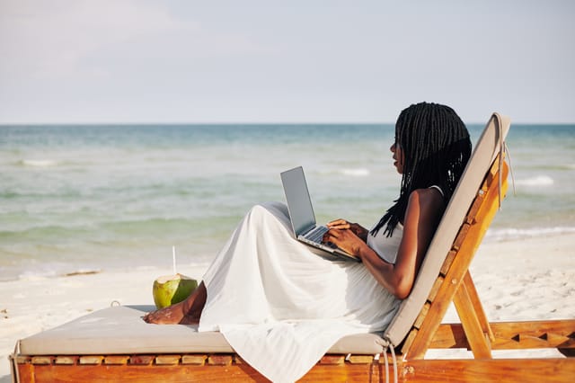 Young,Woman,Enjoying,Sitting,On,Chaise-lounge,,Working,On,Laptop,And Young,Woman,Enjoying,Sitting,On,Chaise-lounge,,Working,On,Laptop,And