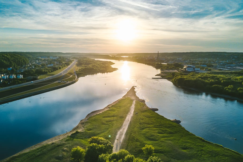An aerial view of a confluence of two rivers An aerial view of a confluence of two rivers