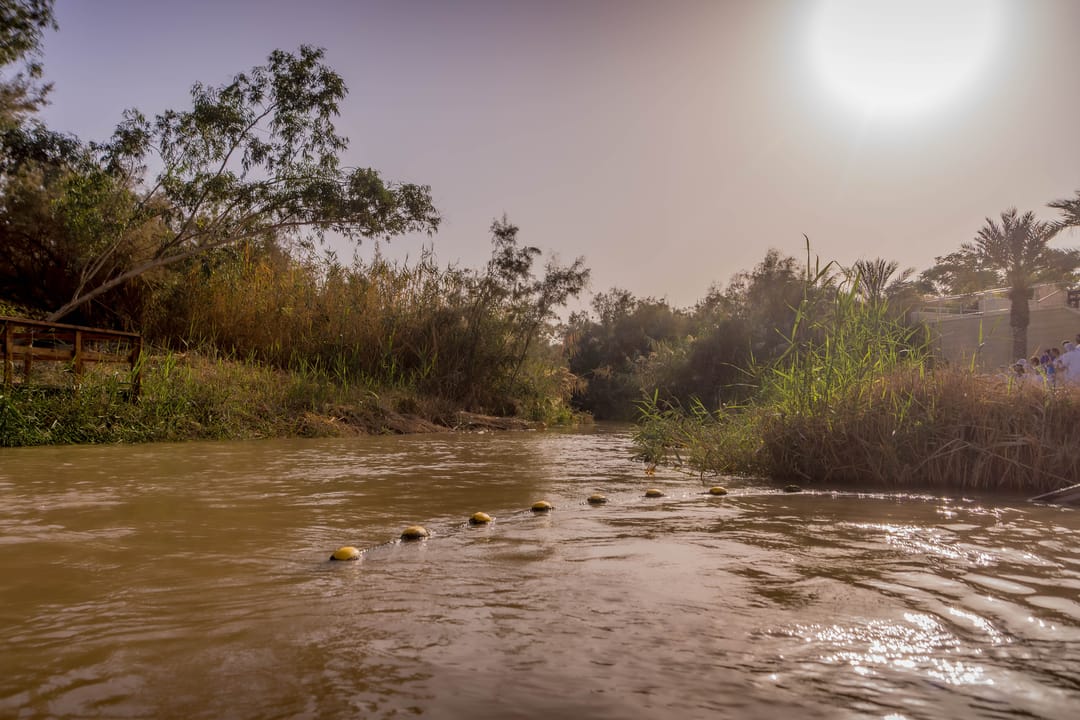 The,Muddy,Water,Of,The,Jordan,River,At,The,Border