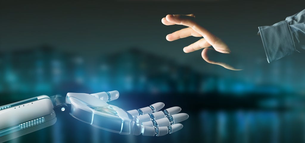 A robot hand on the left reaches towards a human hand on the right, with a blurred blue-black cityscape in the background A robot hand on the left reaches towards a human hand on the right, with a blurred blue-black cityscape in the background