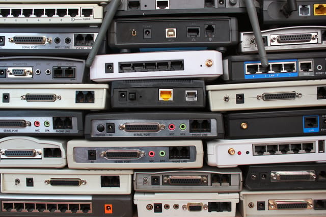 Old modems, routers, network equipment. Serial, phone, audio, ethernet connectors. Old modems, routers, network equipment. Serial, phone, audio, ethernet connectors.
