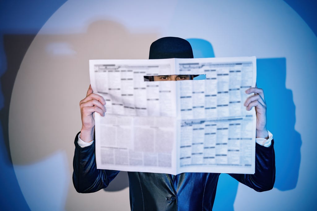 Man,Hiding,Watches,Through,The,Newspaper,In,The,Spotlight,On Man,Hiding,Watches,Through,The,Newspaper,In,The,Spotlight,On