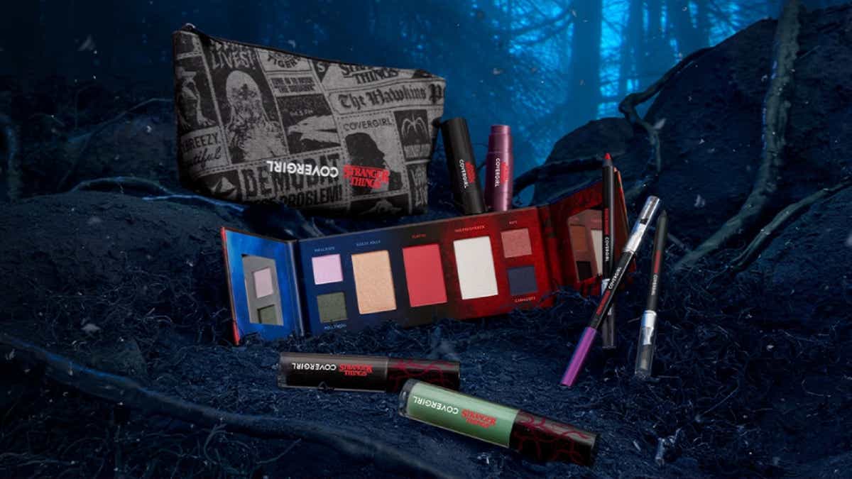 covergirl-x-stranger-things-collection-listing-image.jpg A vibrant makeup collection featuring a Stranger Things themed palette, lipsticks, and eyeliners, set in a dark, mystical forest