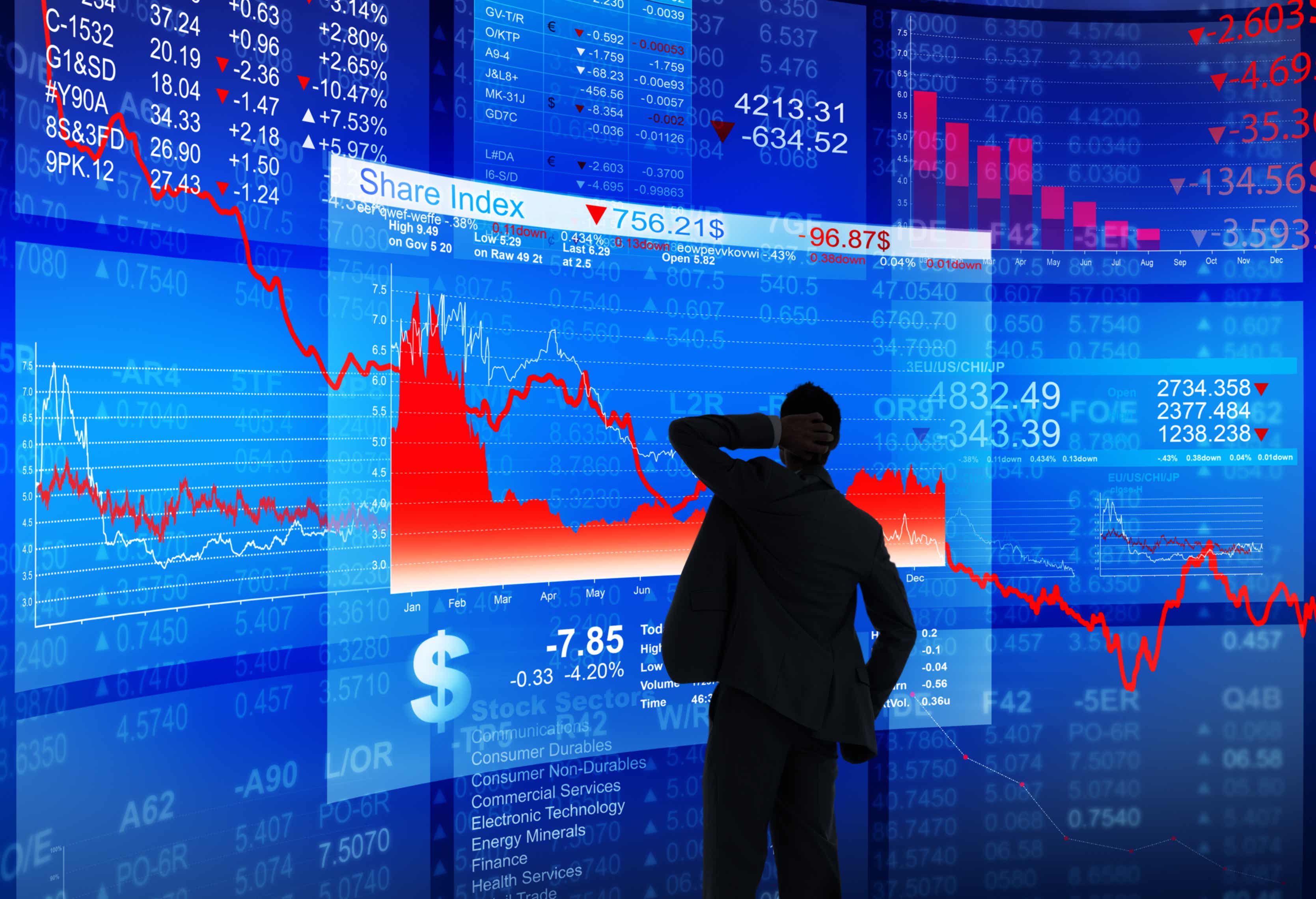 man monitoring stock market crash on a large screen