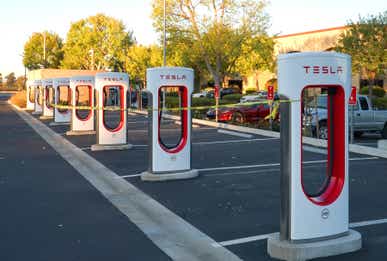 Tesla Chargers NAPA, CALIFORNIA - OCTOBER 10: Tesla charging stations are tied off with caution tape to prevent cars from charging on October 10, 2019 in Napa, California. PG&E has continued plans to cut power to hundreds of thousands of customers across central and northern California as a precaution against starting wildfires as low humidity and high winds increase the threat in the area. (Photo by Thearon W. Henderson/Getty Images)