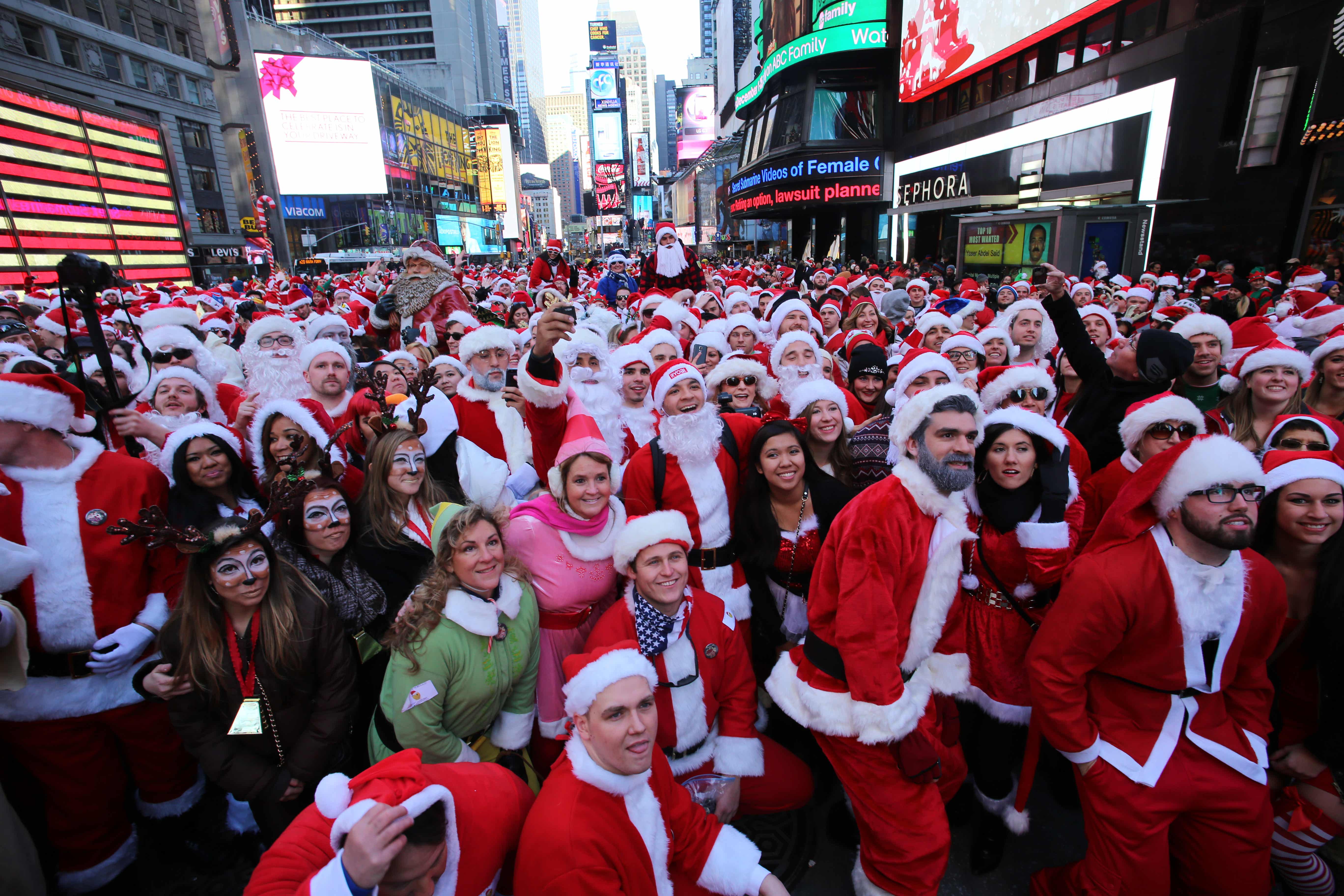 People all dressed up as Santa Claus in Time Square