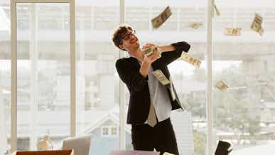 USD/JPY hits two-decade high shown by a man throwing money with excitment