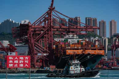 Trading China Pending PMI Data Release - HONG KONG, CHINA - NOVEMBER 10: Container ships sit moored next to shipping containers and gantry canes at Kwai Tsing Container Terminal on November 10, 2021 in Hong Kong, China. Increased consumer demand during the coronavirus pandemic has contributed to several problems straining the global supply chain including a shortage of shipping containers, warehouse capacity, and port congestion. (Photo by Anthony Kwan/Getty Images)