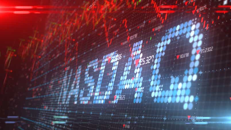 Nasdaq symbol on a blue and red stock exchange screen