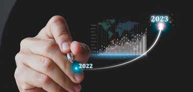 Hand showing virtual reality image with 2022 2023 text