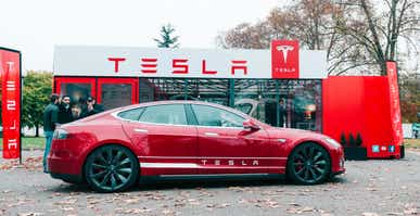 Tesla Model S car in front of showroom