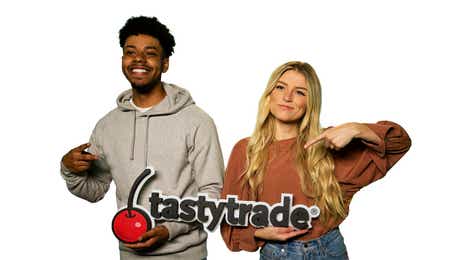 Image of Kay and Errol Holding a tastytrade Sign