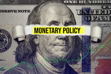 monetary policy highlighted with dollar bill