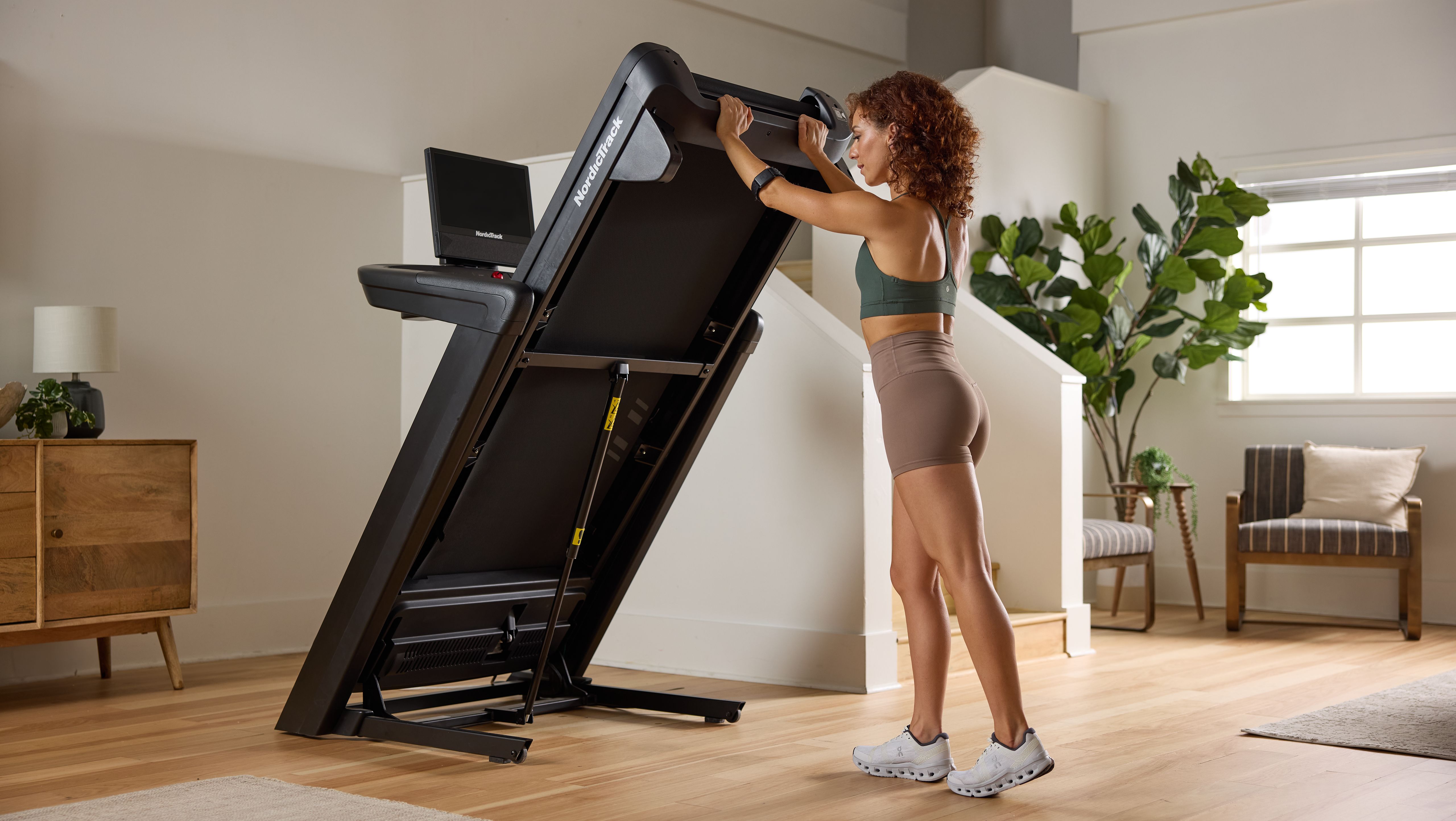 Best NordicTrack treadmill for apartments with foldable design in a modern home setup