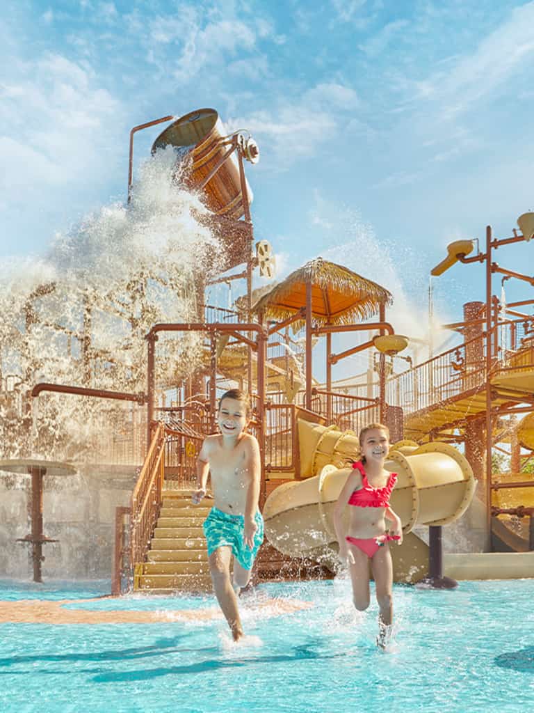 Children playing at Kids Rain Fortress, the kids' water play area at Jungala water park