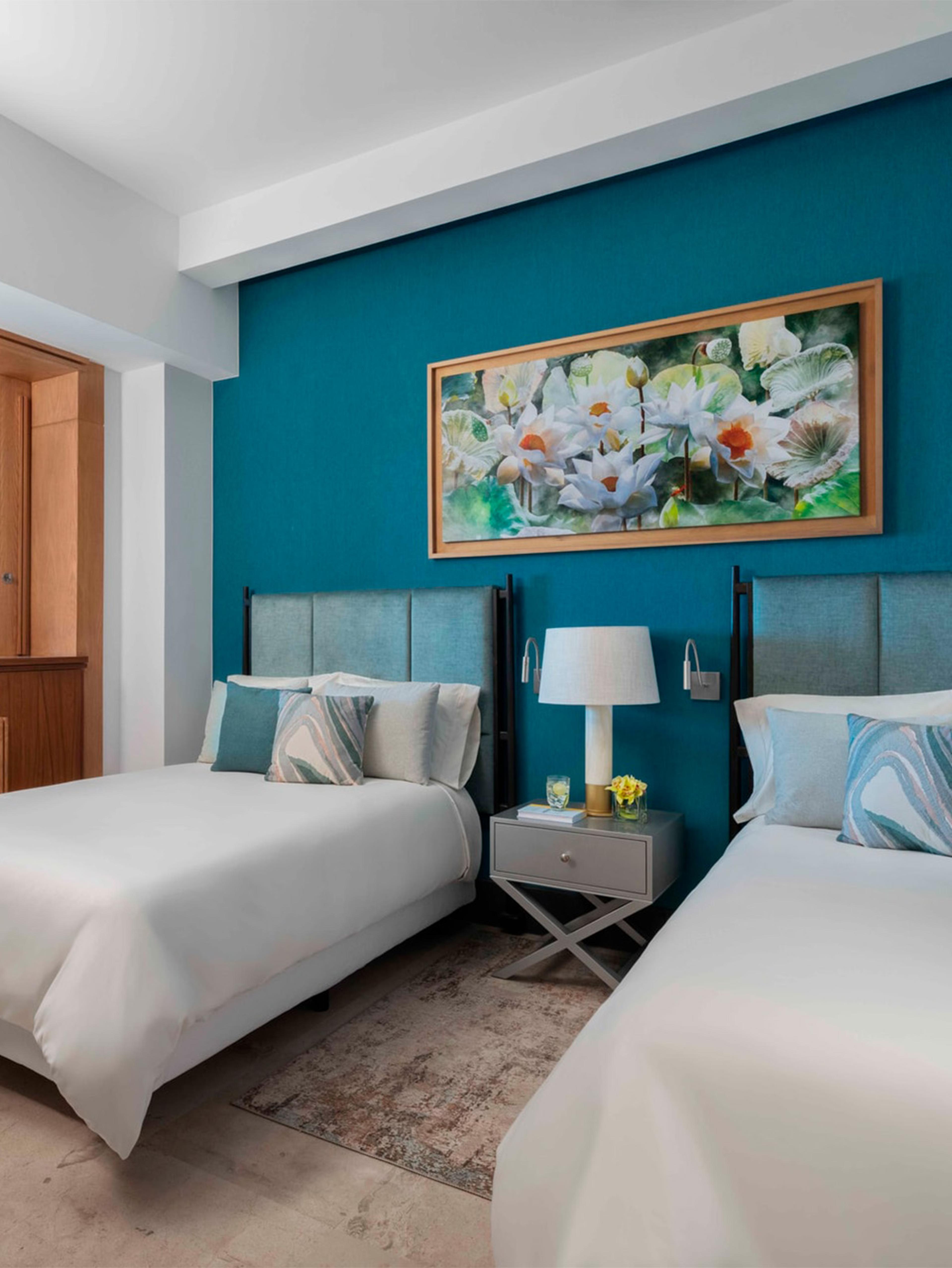 Suite familiar de una recámara con dos camas dobles en BON Hotel VidantaWorld