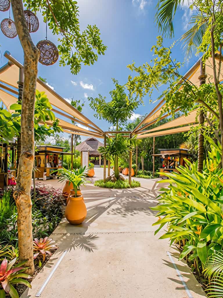 Shopping plaza at Jungala Aqua Experience, surrounded by tropical greenery