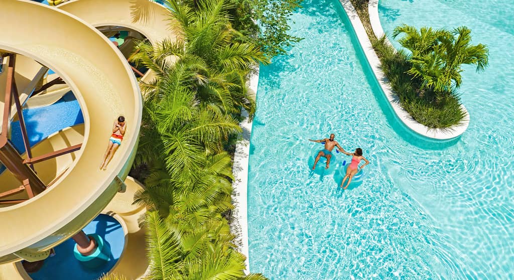 Aerial view of Jungala Aqua Experience with a spiral waterslide and guests on the lazy river