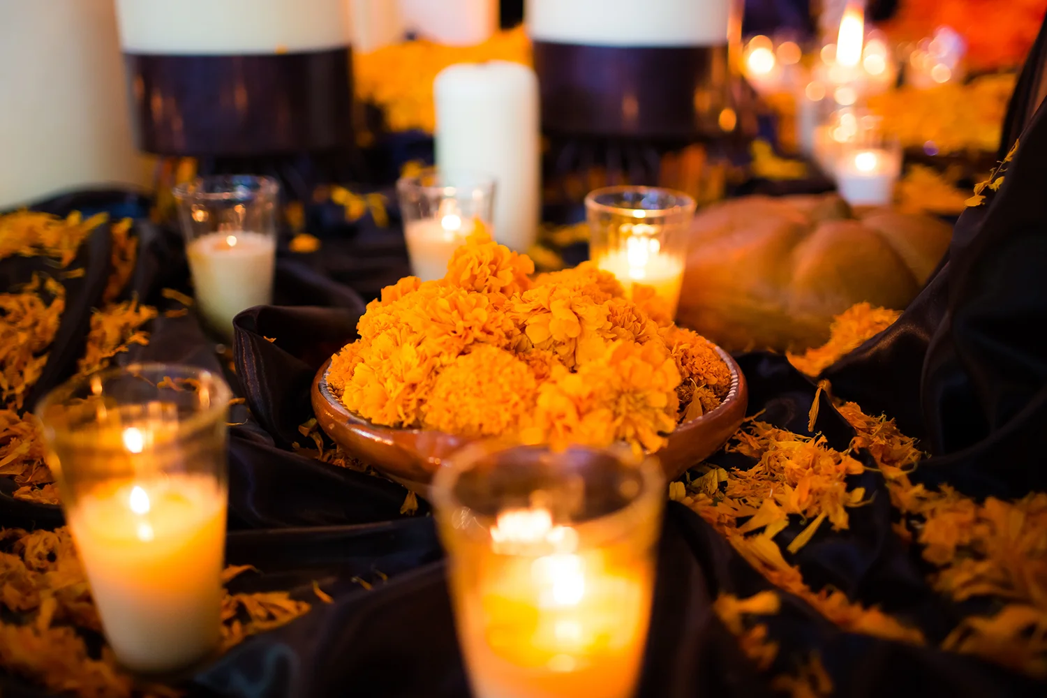 Marigolds and candles on a Día de Muertos altar