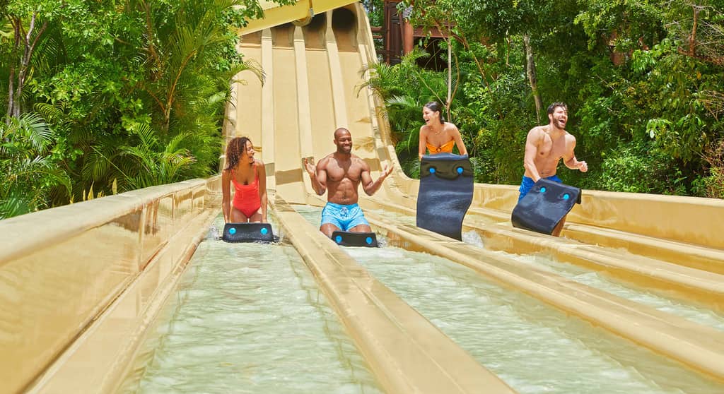 Tropical Whizzard slide at Jungala Aqua Experience with a group of friends riding down