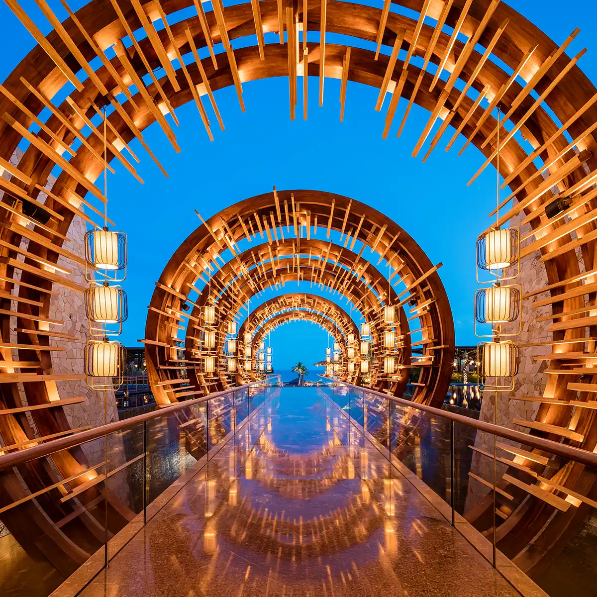 Timber arches framing the sea at Los Cabos
