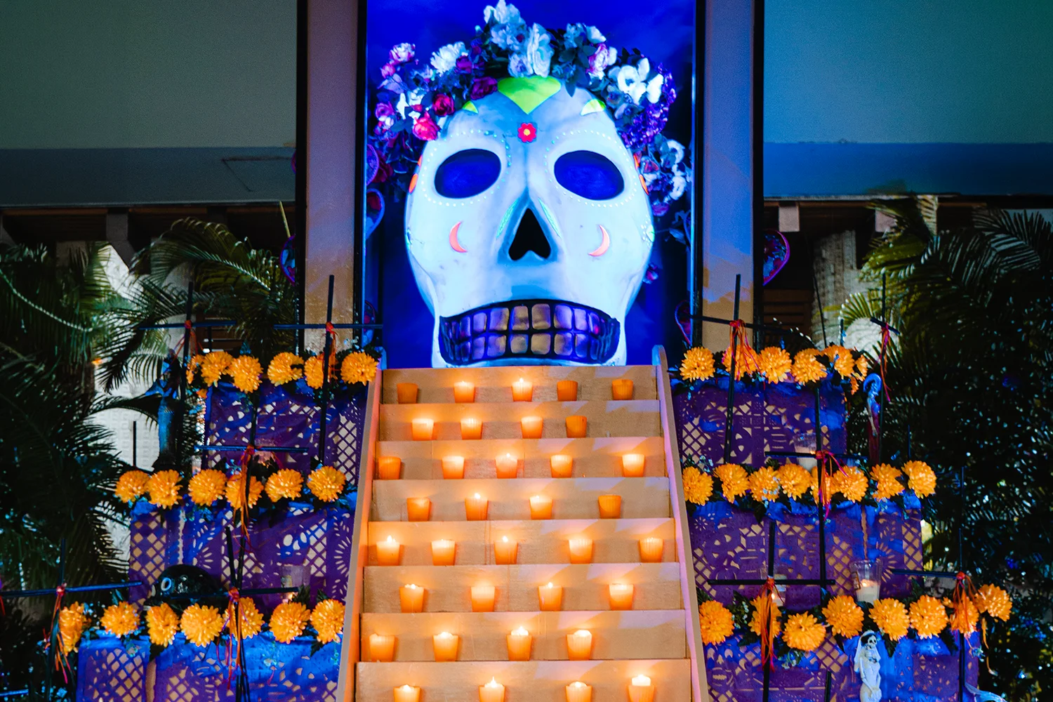 Giant skull altar with candlelit steps and marigolds at Vidanta Riviera Maya