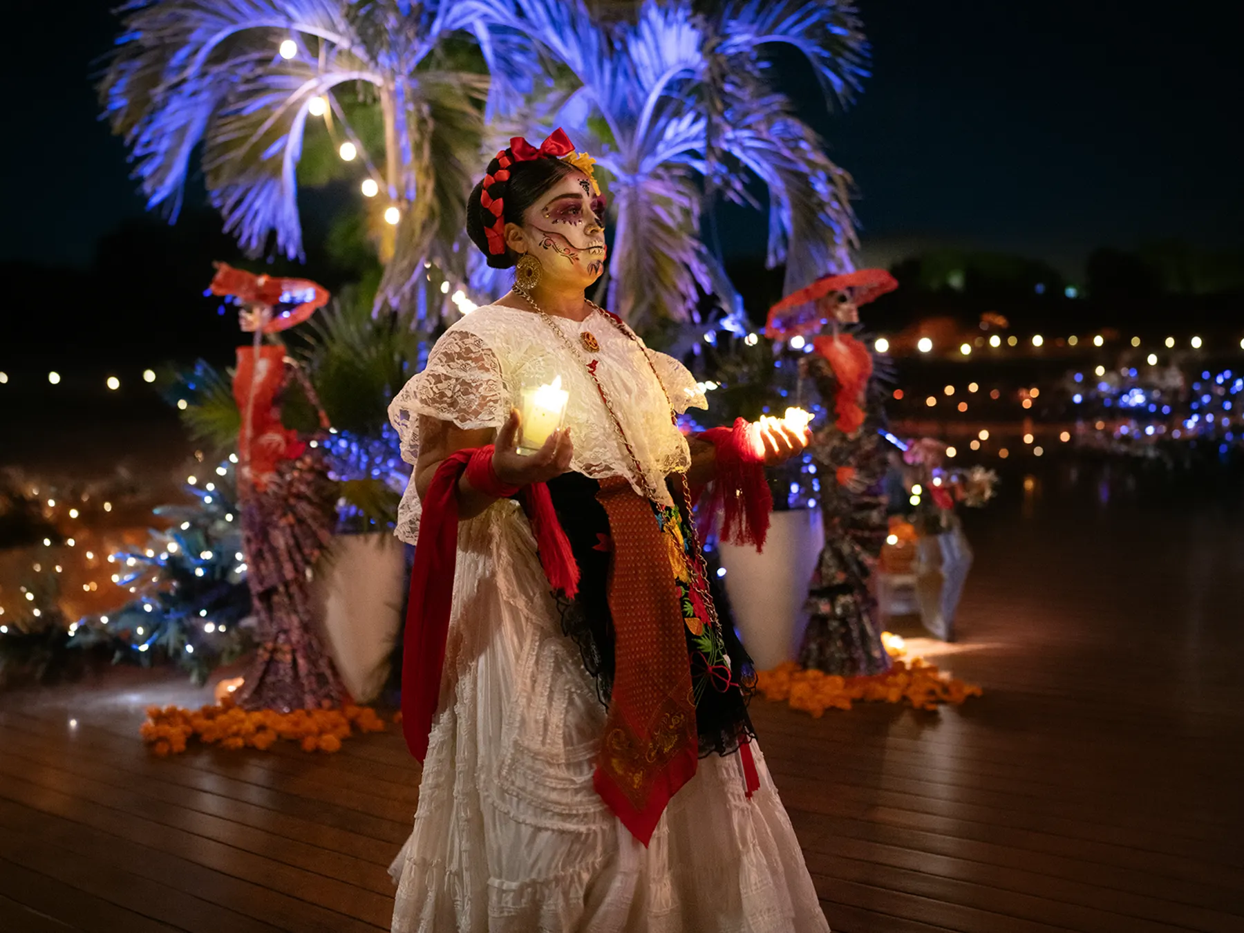 Catrina leading the candlelit procession