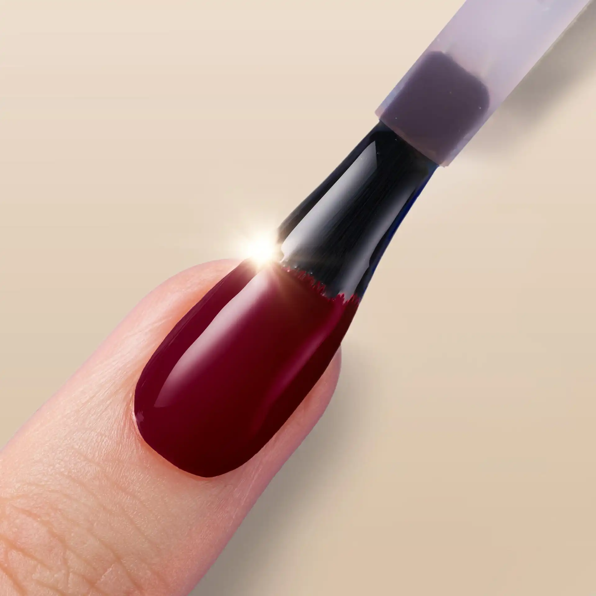 Close-up of a model's hand showcasing freshly painted nails with Sally Hansen Miracle Gel Supercharged Bold Glam nail polish