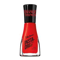 Insta-Dri nail polish bottle with a sleek design, showcasing a vibrant color against a neutral background.