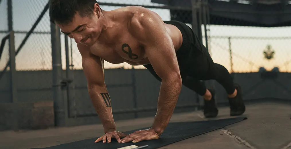 Male athlete performing Diamond Pushups