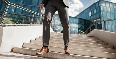 man-in-suit-taking-stairs-movement-snacking.jpg