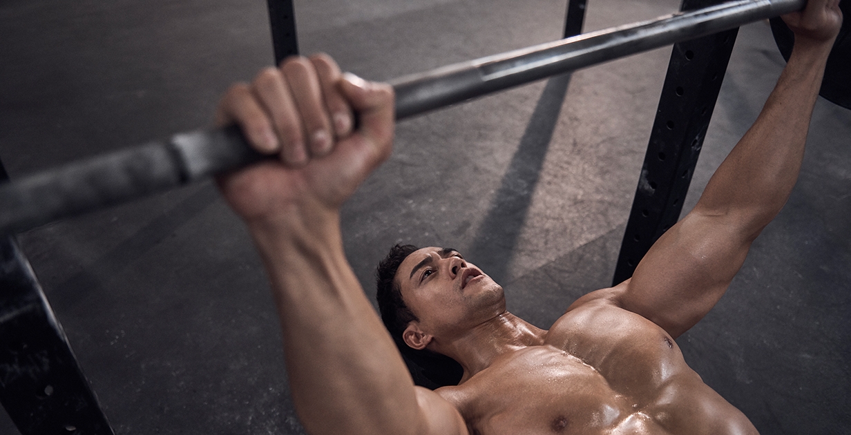 male athlete performing Bench Press