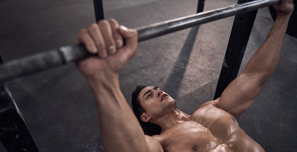 male athlete performing Bench Press