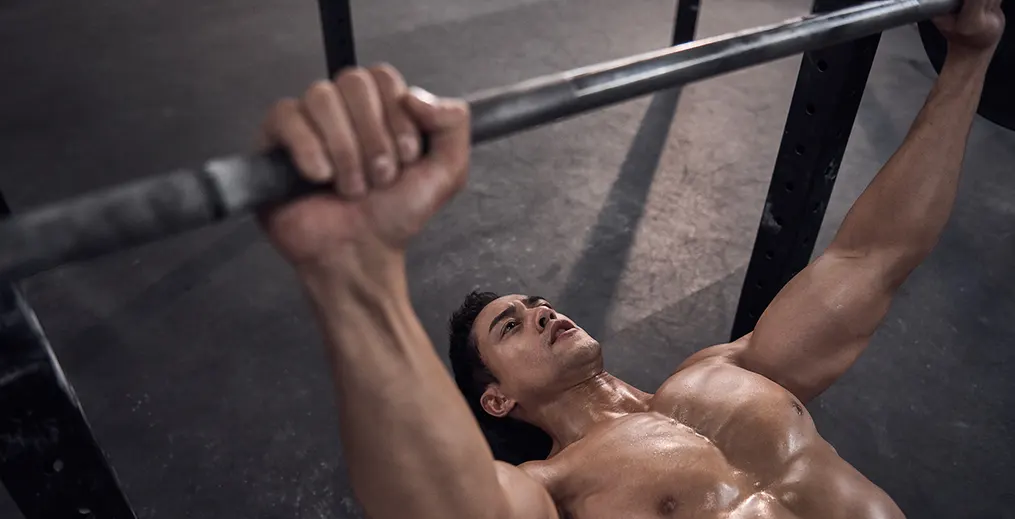male athlete performing Bench Press