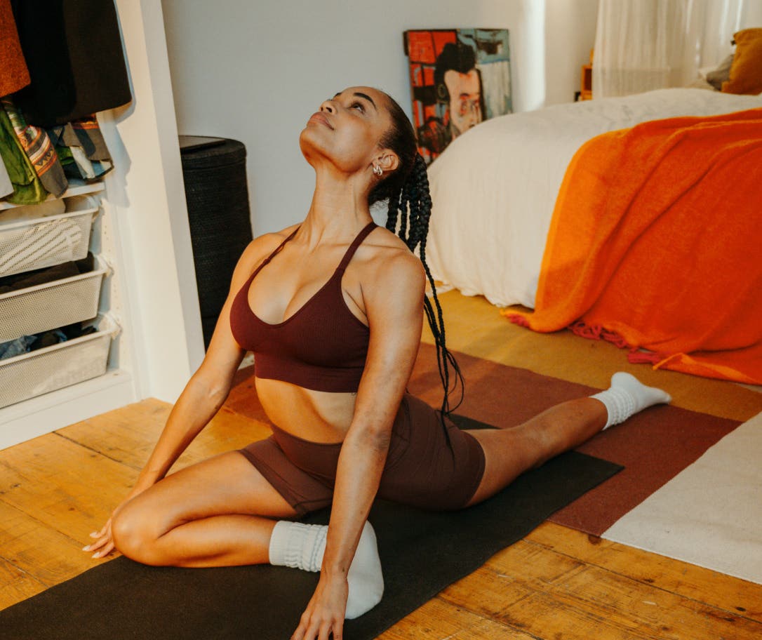 athlete-relaxing-home-yoga-if-benefits.jpg