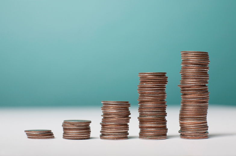 Stacks of coins ascending towards the right.