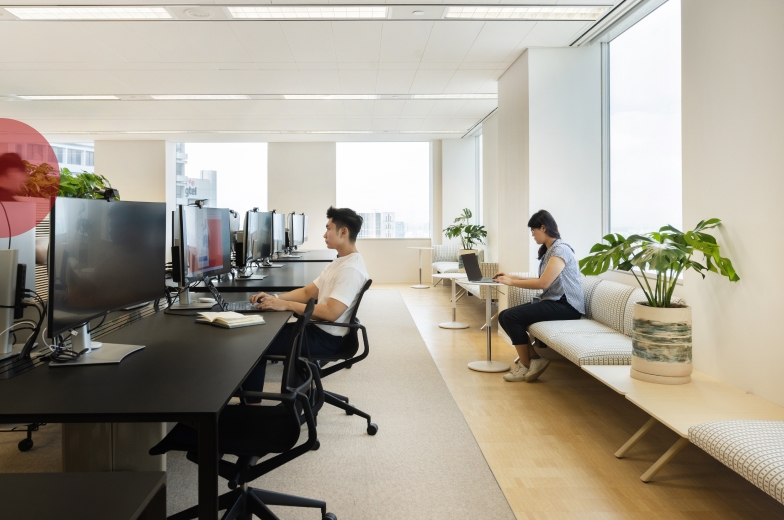 People sitting in office interior.
