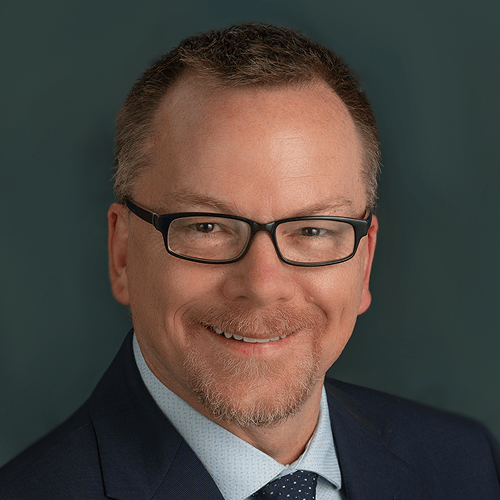 Individual wearing a suit and tie with a blurred face. Individual wearing a suit and tie with a blurred face.