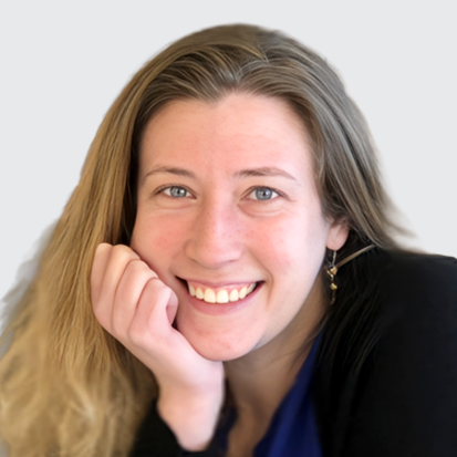 Person with long hair in a casual setting, with face blurred.