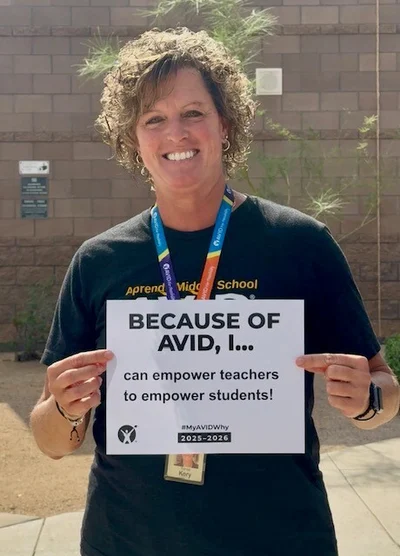 Person holding a sign that says 'Because of AVID, I... can empower teachers to empower students!'