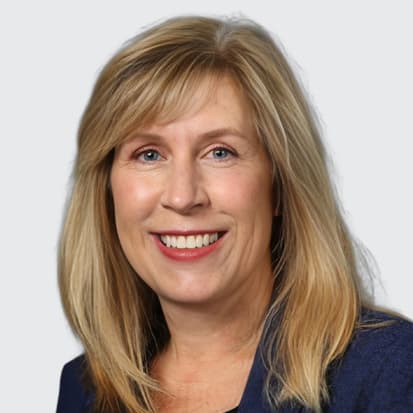 Image of a person with blond hair and a blurred face on a neutral gray background. Image of a person with blond hair and a blurred face on a neutral gray background.