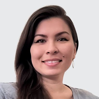 A person with long, dark hair against a plain background. A person with long, dark hair against a plain background.